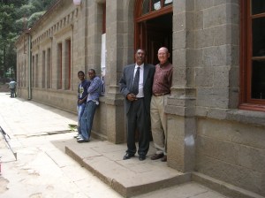 Berhane and Doug at the entrance to the former Tafari Makonnen School administration building